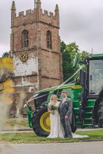 The couple leave in their green tractor